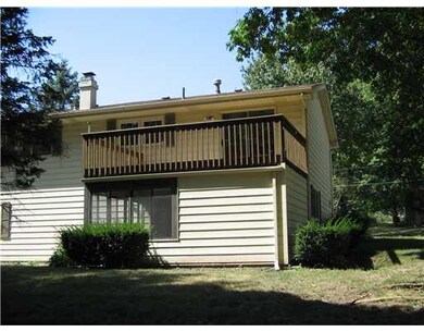 Exterior Back. Deck over 3 season porch & workshop