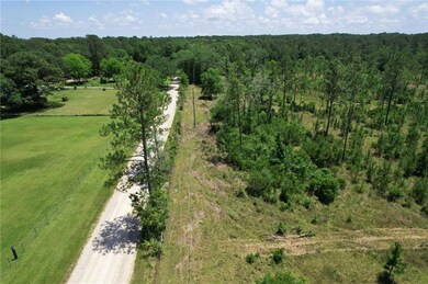 View of rural area with a heavily wooded area