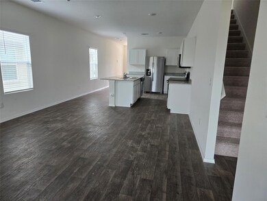 Unfurnished living room featuring dark wood-style