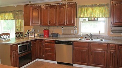 Tiled flooring in Kitchen.  All appliances remain with the property.