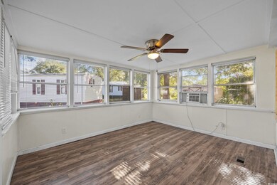Unfurnished sunroom featuring a healthy amount of 