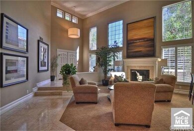 Gorgeous travertine entry leads the way to the for