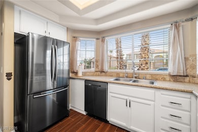 Kitchen featuring stainless steel appliances, a ra