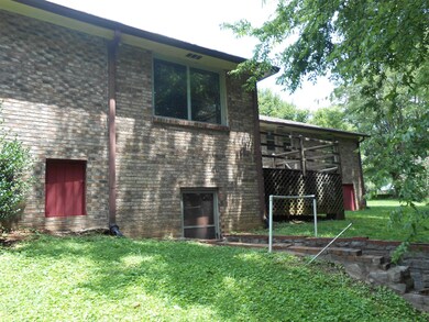 Back View of the home. Small room in basement would be a great storm shelter