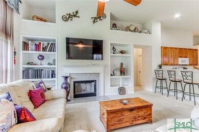 Spacious great room with built-ins, a fireplace & 