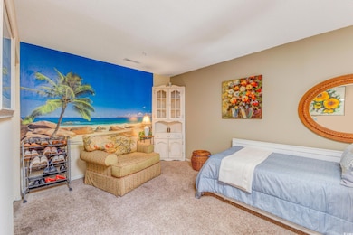 Bedroom featuring visible vents and carpet