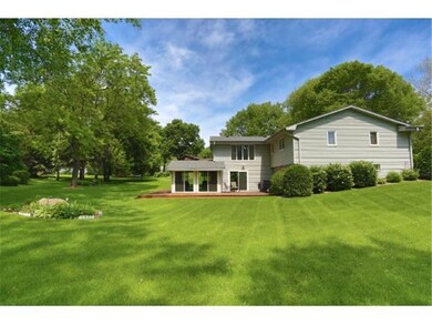 Oversized lot with manicured lawn and landscaping,