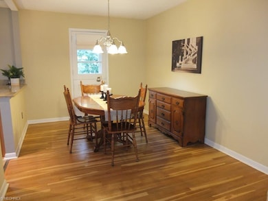 Dining room with white oak flooring.
