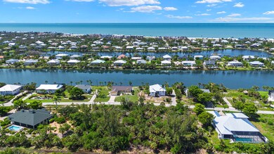 Aerial view of property's location with nearby suburban area and a nearby body of water