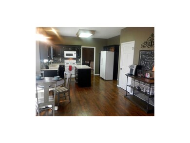Great open kitchen plan with newly refinished wood