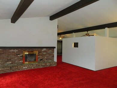 Living Room.  Beautiful brick log-burning fireplac