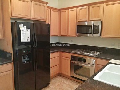 Property Photo. Kitchen has breakfast bar