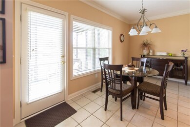 DOOR IN BREAKFAST ROOM OPENS TO LARGE SCREENED IN PORCH AND DECK