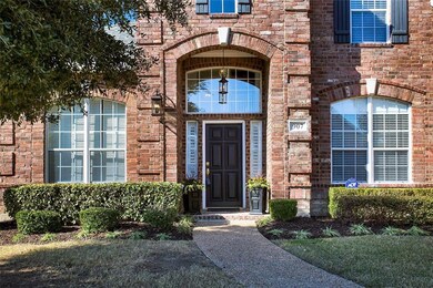 2-story arched covered entry with transom window, 