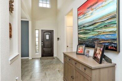 Lovely 2 story entry and beautiful offset tiles in this entry.