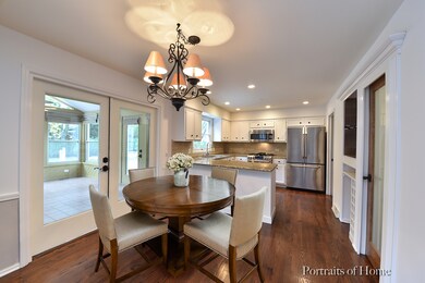 A VIEW OF THE EATING AREA LOOKING INTO THE KITCHEN