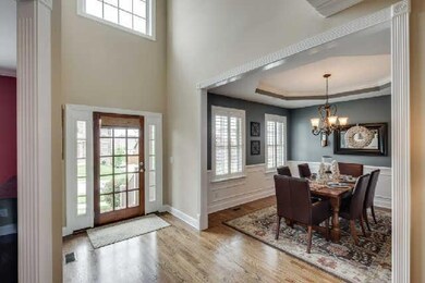 You will be impressed by the two-story entry hall that greets you as you step inside this lovely home.
