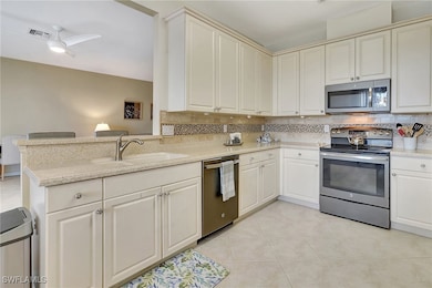 Kitchen featuring sink, light tile patterned floor