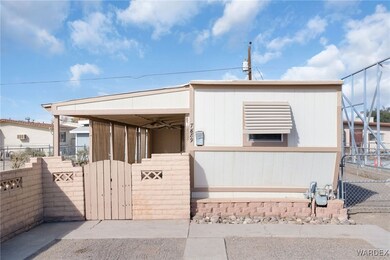 View of front of house featuring a gate and fence
