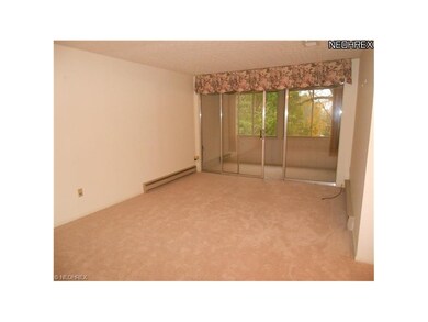 Living room with sliders to three season enclosed 