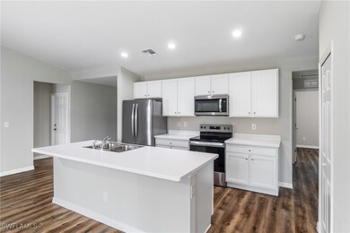 Kitchen with sink, an island with sink, stainless