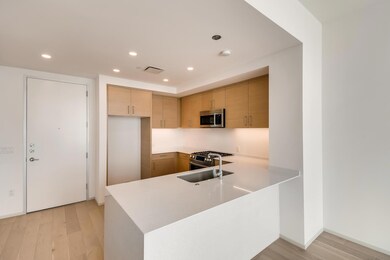 Kitchen with stainless steel appliances, light co