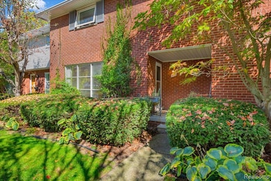 Doorway to property featuring brick siding
