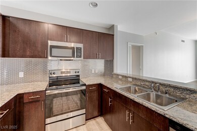 Kitchen with appliances with stainless steel finis