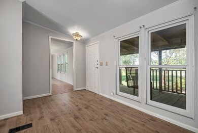The home features lovely gleaming flooring, fantastic oversized windows and very nice crown moldings.