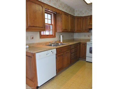 Kitchen has tile backsplash.