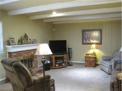 Living Room. Painted beams and warm colored walls 