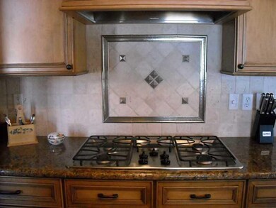Kitchen. Five burner gas stove, gorgeous tumbled m