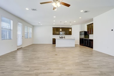Unfurnished living room with recessed lighting, light wood-type flooring, and a ceiling fan