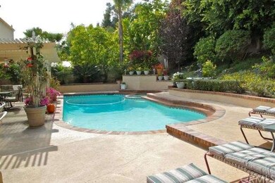 Pool and spa in the backyard, with a gorgeous slop