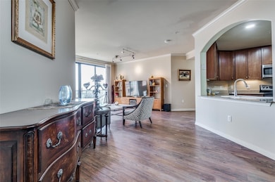 Arched opening in kitchen provides line of sight t
