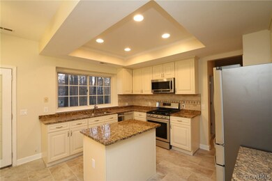 Granite counters, stainless steel appliances, tray