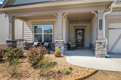 Doorway to property featuring covered porch and st