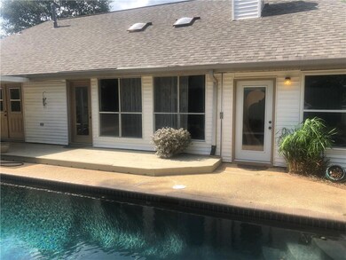 Back of home with pool