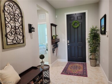 Front entry, two guest bedrooms and bath .