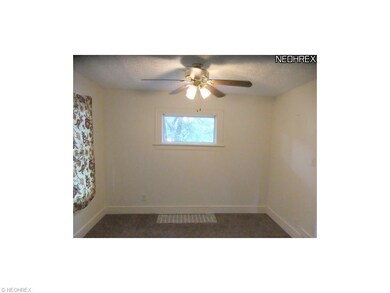 Dining room features neutral decor, windows for na