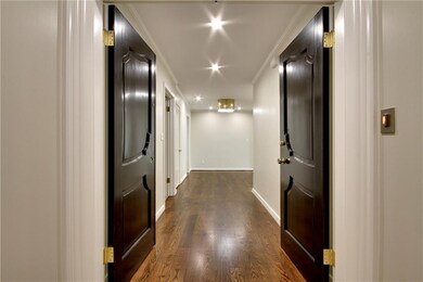 Spacious entry, rich wood floors and recessed LED 