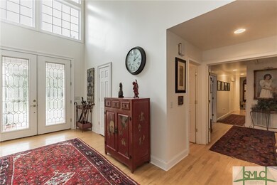 Foyer with view of hallway to owner's suite and be