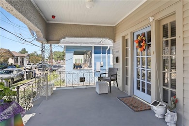 The deep front porch is a big plus...perfect for e