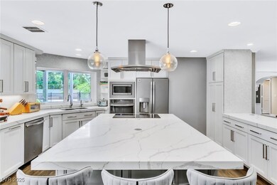 Kitchen with stainless steel appliances, island ex