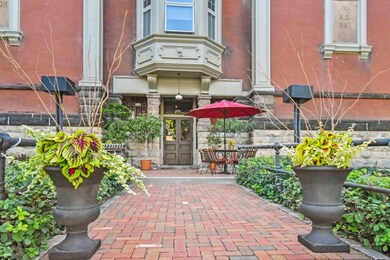 Beautiful brick patio welcomes you into the buildi