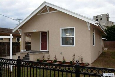 nicely landscaped front fenced yard
