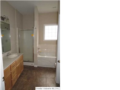 Master bathroom with large walk in closet