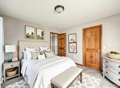 Digitally Staged Bedroom featuring light carpet and baseboards