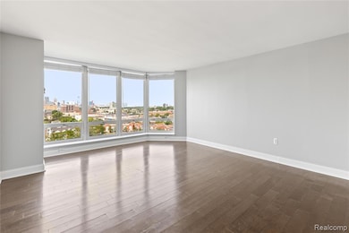 Combo Living/Dining Room with west views of the Detroit Skyline and Riverwalk