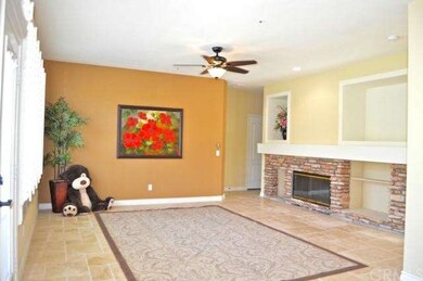 Family room, travertine, stone fireplace off kitch
